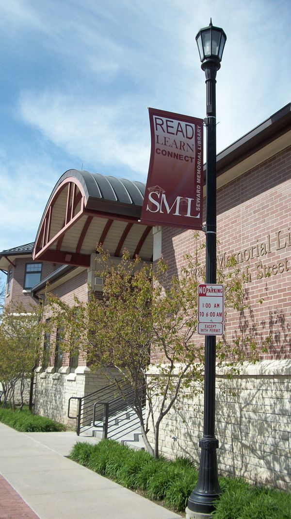 Light pole banner and stairs on the east entrance of the Seward Memorial Library